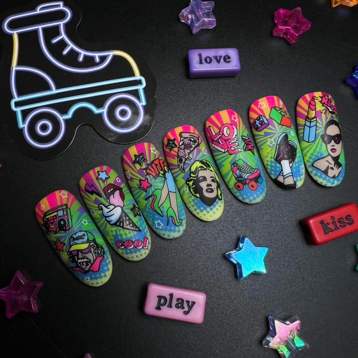 Colorful roller skate-shaped on a black surface with decorative stars and text magnets.