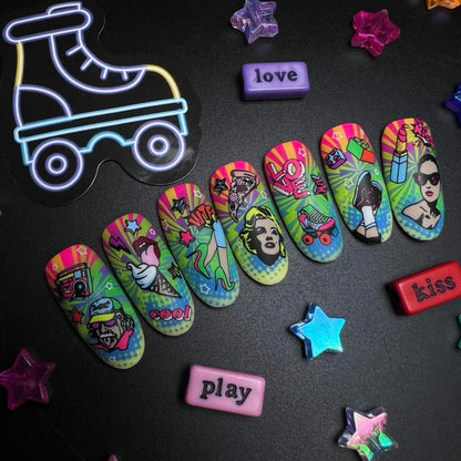 Colorful roller skate-shaped on a black surface with decorative stars and text magnets.