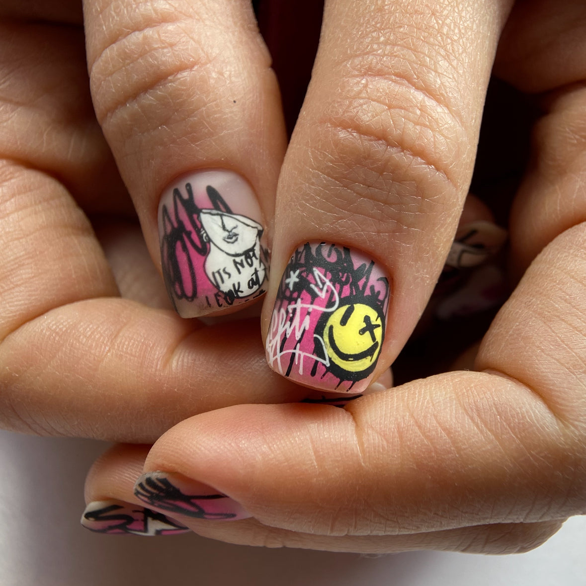 Nails with colorful designs on a light background
