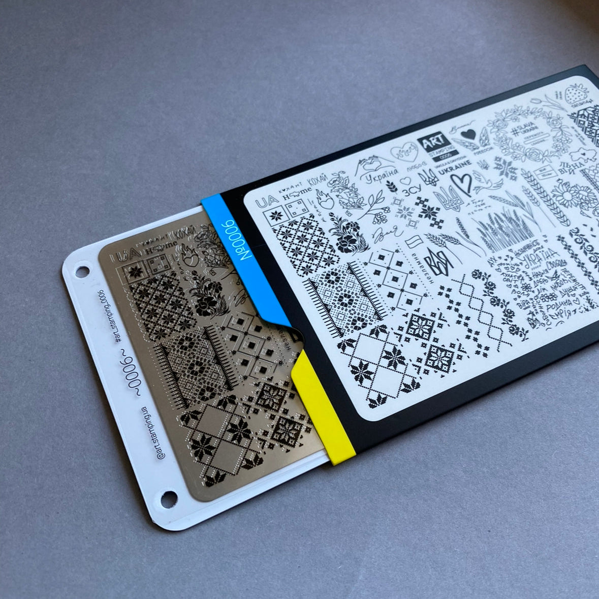 Two stencils with geometric patterns on a gray surface